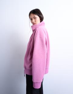 Model wearing Borg funnel zip through in pink