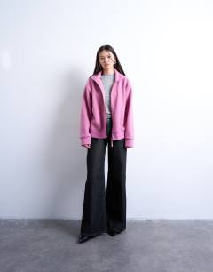 Model wearing Borg funnel zip through in pink