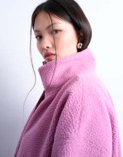 Model wearing Borg funnel zip through in pink