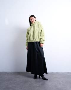 Model wearing Borg oversized hoodie in sage green