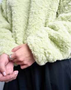 Model wearing Borg oversized hoodie in sage green