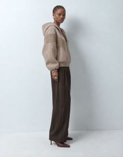 Model wearing Borg panelled zip up hoodie in oat