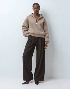 Model wearing Borg panelled zip up hoodie in oat
