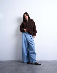 Model wearing Borg quarter zip top in dark brown