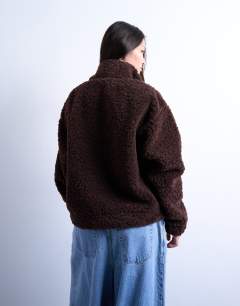 Model wearing Borg quarter zip top in dark brown
