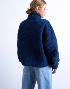 Model wearing Borg quarter zip top in navy