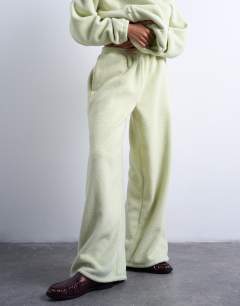 Model wearing Borg straight leg joggers co-ord in lime green