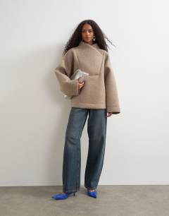 Model wearing Borg wrap neck sweat in oat
