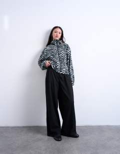 Model wearing Borg zebra print zip through fleece in monochrome