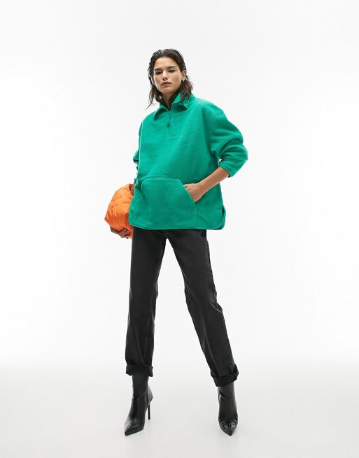 Topshop turquoise green zip collar borg fleece sweat with Spread collar, half Zip fastening, Pouch pocket
and Relaxed fit.