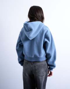 Model wearing Borg zip through hoodie in blue