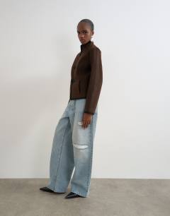 Model wearing Boucle short mandarin jacket with frogging in chocolate