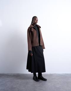 Model wearing Boucle tab detail bomber in chocolate