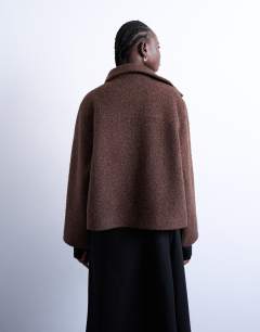 Model wearing Boucle tab detail bomber in chocolate