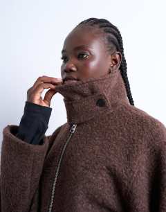 Model wearing Boucle tab detail bomber in chocolate