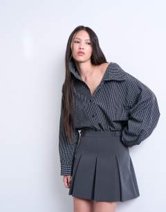Model wearing Box pleat grey mini skirt