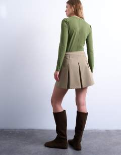 Model wearing Box pleat taupe mini skirt