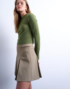 Model wearing Box pleat taupe mini skirt