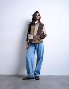 Model wearing Boxy faux suede patchwork zip through jacket in multi