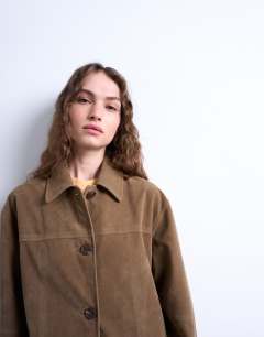 Model wearing Boxy mid length high break faux suede jacket in brown