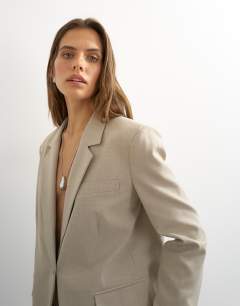 Model wearing Boyfriend single breasted blazer in beige