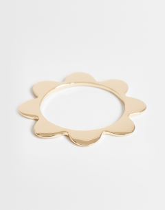 Model wearing Bradley bangle in gold