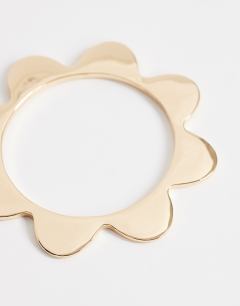 Model wearing Bradley bangle in gold