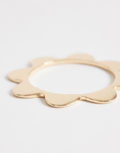 Model wearing Bradley bangle in gold