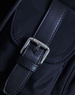 Model wearing Bradley large nylon & pu backpack with pockets in black