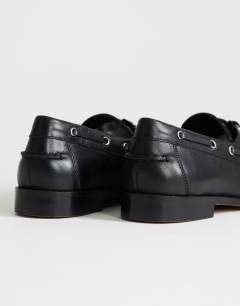 Model wearing Brandi leather lace up shoe in black