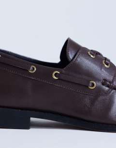 Model wearing Brandi leather lace up shoe in chocolate