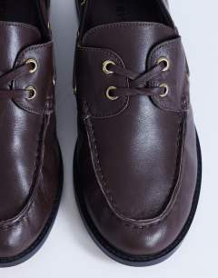 Model wearing Brandi leather lace up shoe in chocolate