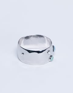 Model wearing Bree large bangle bracelet with stones in silver