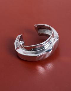 Model wearing Brena asymmetric bangle in silver