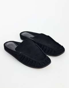 Model wearing Brianna real suede ruched mule in black