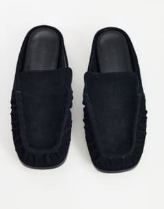 Model wearing Brianna real suede ruched mule in black