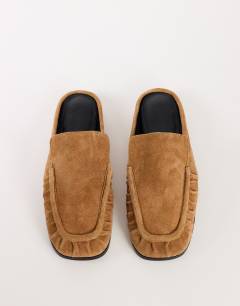 Model wearing Brianna real suede ruched mule in tan