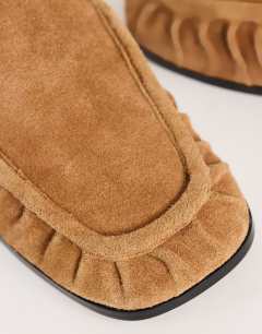 Model wearing Brianna real suede ruched mule in tan