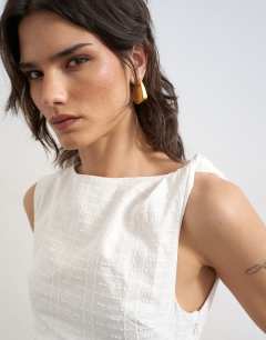 Model wearing Broderie twist shoulder mini dress in white