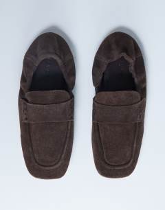 Model wearing Brooks ruched back real suede leather flat shoe in chocolate