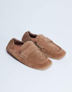 Model wearing Brooks ruched back real suede leather flat shoe in tan