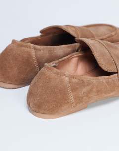 Model wearing Brooks ruched back real suede leather flat shoe in tan