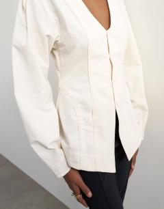 Model wearing Brushed cotton cocoon sleeve structured button through top in ecru
