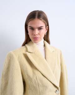 Model wearing Brushed ovoid sleeve cinch waist blazer coat in buttermilk