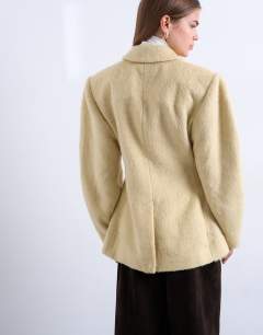Model wearing Brushed ovoid sleeve cinch waist blazer coat in buttermilk