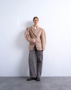Model wearing Brushed ovoid sleeve cinch waist blazer coat in camel