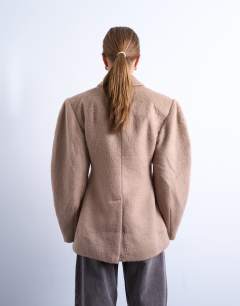 Model wearing Brushed ovoid sleeve cinch waist blazer coat in camel
