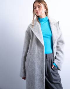 Model wearing Brushed unlined dropped shoulder clean chuck on coat with wool in grey marl