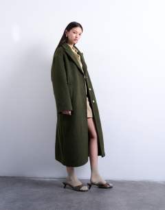 Model wearing Brushed unlined dropped shoulder clean chuck on coat with wool in khaki
