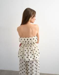 Model wearing Bubble hem linen bandeau top in spot